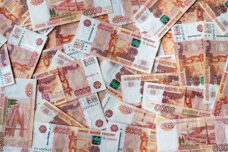 5000 Russian Ruble cash bank note background with five thousand Ruble notes scattered to fill the frameの写真素材