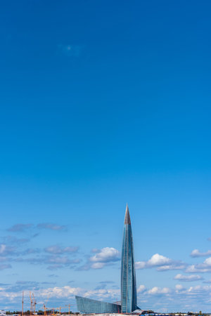 Lakhta Center, Europe's tallest building, under the blue sky overlooking the Gulf of Finland, Saint Petersburg, Russia. Cranes are still visible as the building was recently completed in 2019.の写真素材