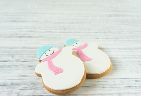 Ginger snowman cookies on wood background. Christmas background, flat lay, top view. Xmas themeの写真素材