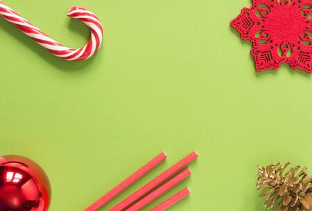Christmas background. Christmas stuff on green background. Flat lay, top viewの写真素材