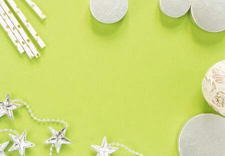 Christmas background. Christmas stuff on green background. Flat lay, top viewの写真素材
