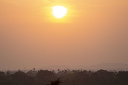Sunset photo - Sun coming down to horizonの写真素材