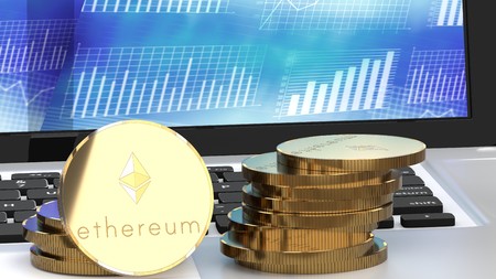 Stack of golden ethereum coins, bitcoin alternatives, on a laptop, close up, 3d illustrationの写真素材