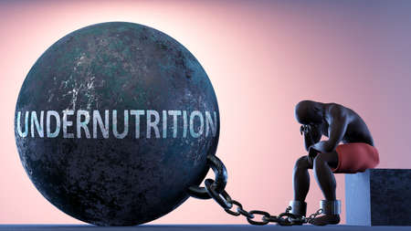 Undernutrition as a heavy weight in life - symbolized by a person in chains attached to a prisoner ball to show that Undernutrition can cause suffering, 3d illustrationの写真素材