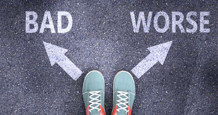 Bad and worse as different choices in life - pictured as words Bad, worse on a road to symbolize making decision and picking either Bad or worse as an option, 3d illustrationの写真素材