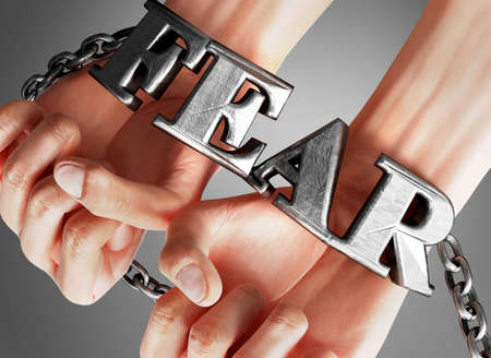 Fear restricting life and freedom, bringing enslavement, pain and misery to human life - symbolized...