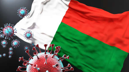 Madagascar and the covid pandemic - corona virus attacking national flag of Madagascar to symbolize the fight, struggle and the virus presence in this country, 3d illustrationの写真素材