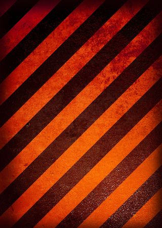 Grunge black and orange warning background with grunge effectの写真素材