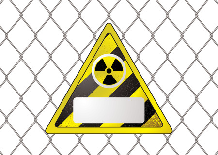 triangular nuclear sign attached to a wire fence with copy spaceのイラスト素材