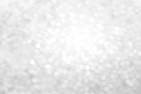 White and silver bokeh abstract light background.の写真素材