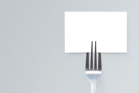 Blank paper mockup card and fork. Creative layout for business food concept. の写真素材