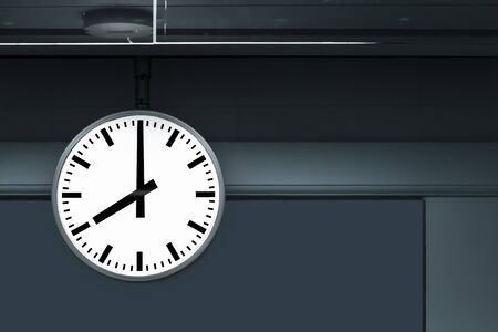 Large clock in railway station at the hanging with roof of building central station for watch time waiting train. The time with business travel concept. with copy space for text.の写真素材