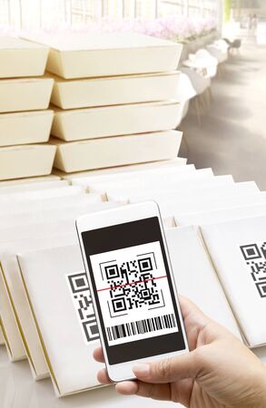 Online order food shopping and delivery service on touch screen. Woman hand holding smart phone scanning Qr code payment. Business digital and pay cashless technology with E wallet concept.の写真素材