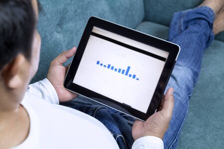 Businessman working from home on tablet and making shopping online order food form mobile on touch...