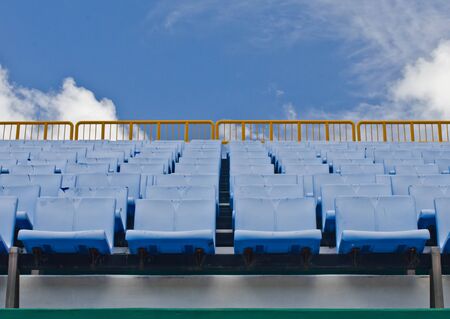 Seats and blue sky in the stadium.