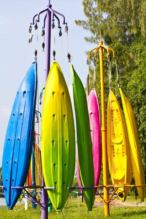 Colorful of Canoe hanging on a pole の写真素材