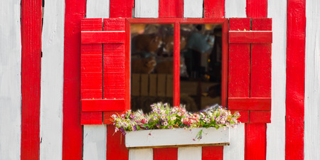 Flowers with red and old wooden window の写真素材