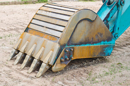 Excavator bucket on the sandの写真素材