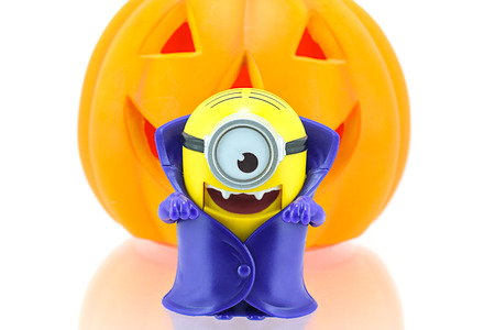 Bangkok, Thailand - September 27, 2015: Vampire minions toy character with pumpkin in background...