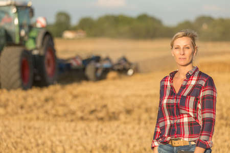 female farmer with tractorの写真素材
