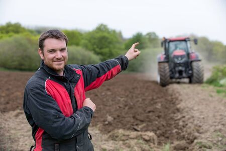 farmer showing new tractor
