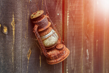 Old lamp on a wooden backgroundの写真素材