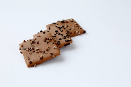 Some chocolate cookies on a white backgroundの写真素材