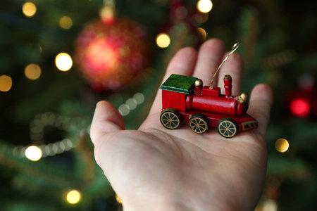 Holding a Christmas wooden toyの写真素材