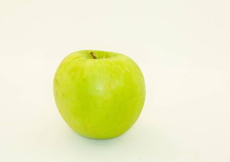 green apple on a white backgroundの写真素材