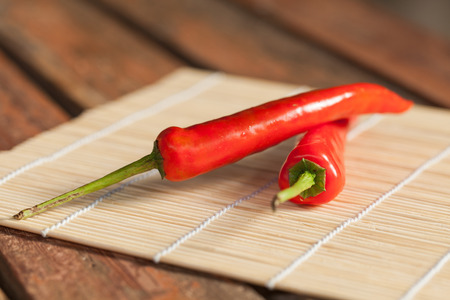 Red Chile on bamboo matの写真素材