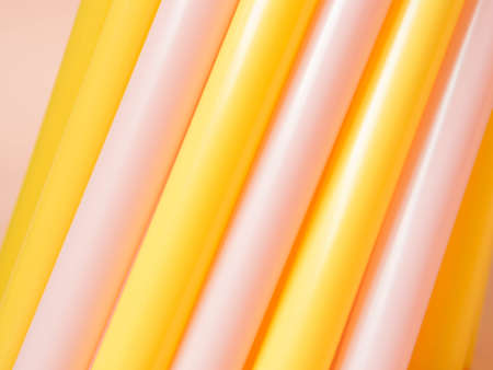 straws pink and yellow backgroundの写真素材