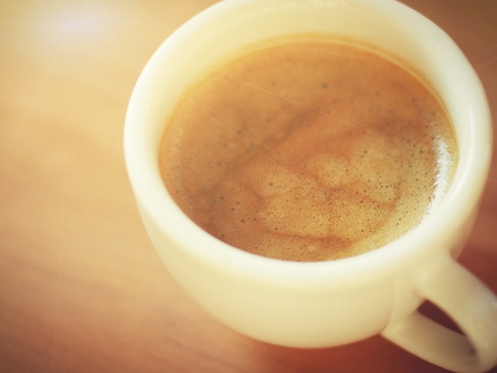 Coffee in a white mug and Warm light in the morningの写真素材