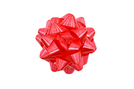 Red ribbon bow isolated in white background.の写真素材