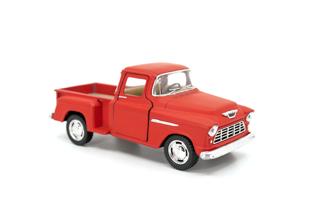 Red pickup model toy isolated on white background.の写真素材
