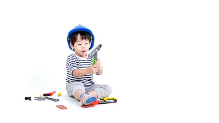 ittle boy playing act engineer, education concept.の写真素材