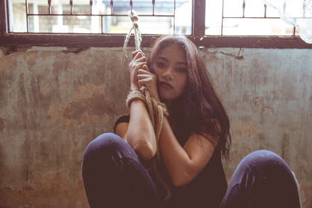 sad woman sit alone feeling bad.の写真素材