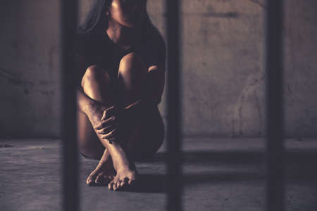 criminal tying hands with handcuffs.の写真素材