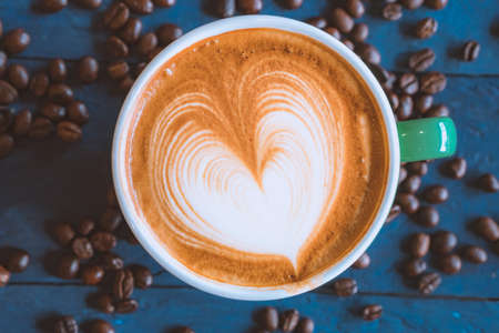 coffee latte art on wood table, relax time, cafe barista art top view.の写真素材