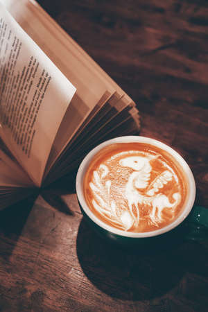 coffee latte art on wood table, relax time, cafe barista art top view.の写真素材