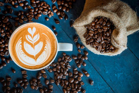 coffee latte art on wood table, relax time, cafe barista art top view.の写真素材