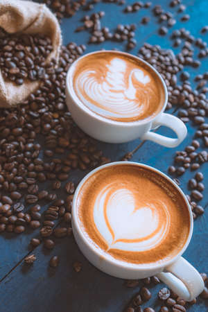 coffee latte art on wood table, relax time, cafe barista art top view.の写真素材