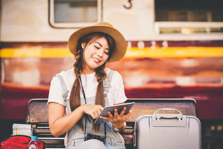 Happy shopper asian woman holding credit card online shoppingの写真素材