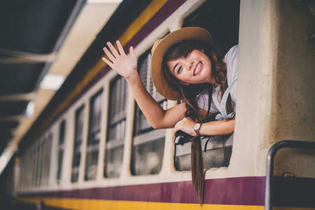 Happy shopper asian woman holding credit card online shopping