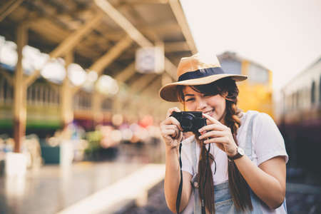 Happy shopper asian woman holding a shopping bagの写真素材