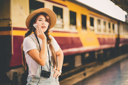 asian woman traveler tourists travel city street, journey backpack adventure outdoor by train.の写真素材