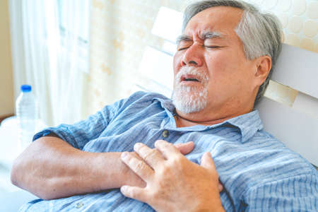 Mature man have a headache.