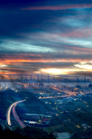 Taipei port's sunset and a highway through the port it の写真素材