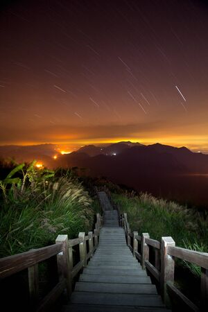 Night landscape in mountains and the dark blue sky with clouds の写真素材