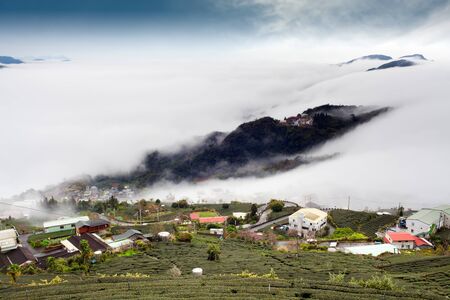 Sunshine with mountain , cloud and fog in the morningの写真素材