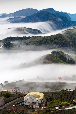 Sunshine with mountain , cloud and fog in the morningの写真素材